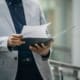 Person Looking Through Paperwork