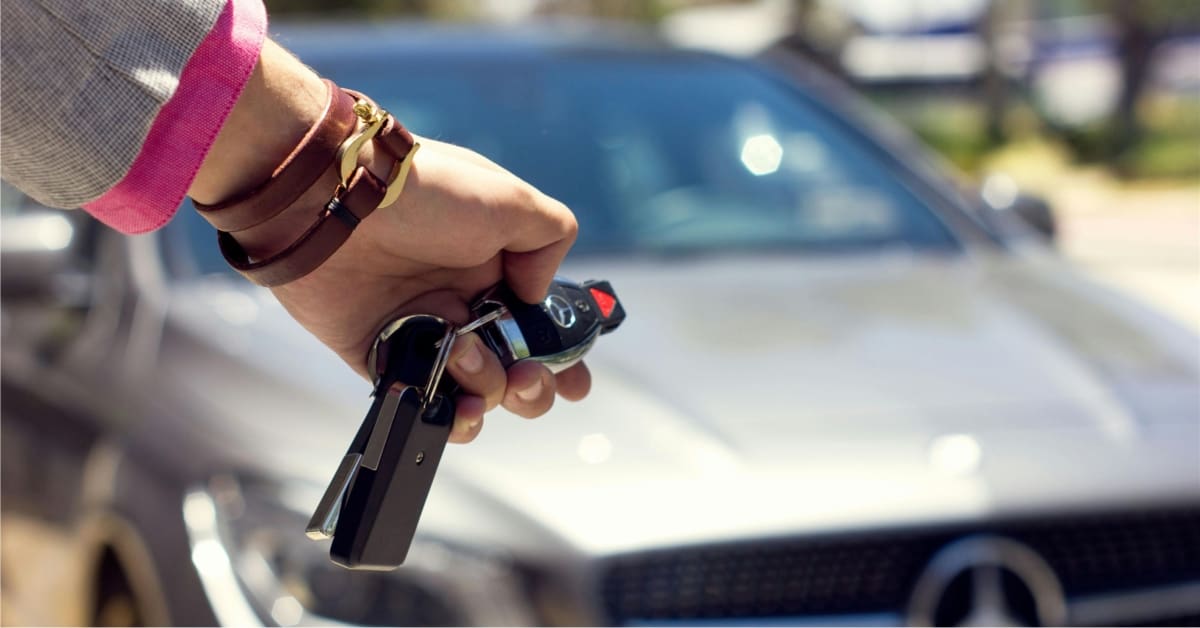 Person holding car keys