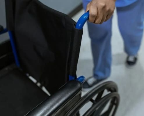 Person pushing wheel chair