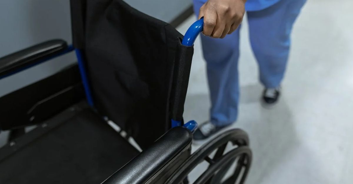 Person pushing wheel chair